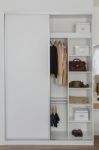 White Closet With Clothes And Accessories Stock Photo