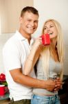 Couple In Kitchen With Coffee Stock Photo