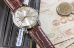 Watch And Wallet On Banknote Stock Photo