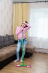 Tired Woman Washing Wooden Floor With A Mop Stock Photo