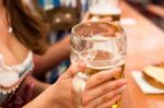 Young Couple Toasting In Oktoberfest Beer Tent Stock Photo