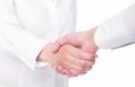 Handshaking Female Hands Stock Photo