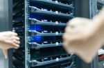 Man Fix Server Network In Data Center Room Stock Photo