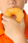 Boy Eating A Donut Stock Photo