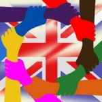 Holding Hands Represents Union Jack And British Stock Photo