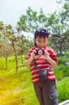 Happy Asian Boy Relaxing Outdoors In The Day Time, Travel On Vacation Stock Photo