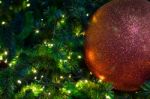 Close Up Big Red Glitter Ball Christmas On Tree With Wire White Light Background Stock Photo