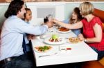 Family Dinner At Restaurant Stock Photo