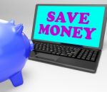 Save Money Laptop Shows Spare Cash And Savings Stock Photo