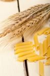 Italian Pasta Penne With Wheat Stock Photo