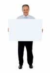 Old Businessman Holding Blank Board Stock Photo