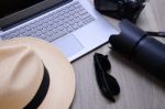 Closeup Of A Wooden Table With Laptop Stock Photo