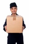 Young Boy Delivering Parcel Safely Stock Photo