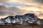 Snowy Icelandic Mountains With Dramatic Cloudy Sky Stock Photo