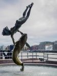 David Wayne Sculpture Girl With The Dolphin Next To Tower Bridge Stock Photo