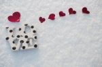 Red Hearts And Love On Snow Stock Photo