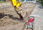 Construction Of A New Road. Excavator Prepares The Surface Stock Photo