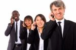 Multi Ethnic Team With Mobile Stock Photo