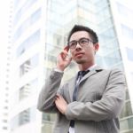 Young Business Man Thinking Stock Photo