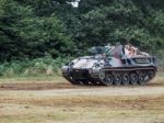 People Enjoying A Ride In An Armoured Car At Dunsfold Airfield Stock Photo