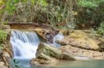 The Water Flowing Over Rocks And Trees Down A Waterfall At Huay Mae Khamin Waterfall National Park ,kanchana Buri In Thailand Stock Photo