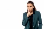 Serious Business Woman Making Silence Sign Stock Photo