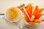 Fresh Hummus Dip With Raw Carrot And Celery Stock Photo