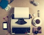 Typewriter And Personal Items On The Table Stock Photo