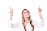 Casual Women Pointing Upwards Stock Photo