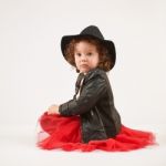 Little Girl Fashion Model With Black Hat Stock Photo