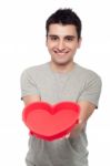 Casual Man Holding Heart Stock Photo