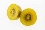 Kiwi Slices Into Half On White Background Stock Photo