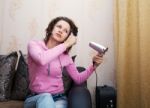 Woman Dries The Hair Dryer Stock Photo