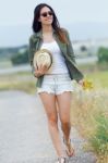 Beautiful Young Woman Walking In The Park Stock Photo