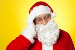 Portrait Of Santa Claus Suffering From Headache Stock Photo