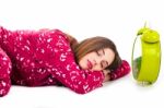 Sleeping Girl With Clock Stock Photo