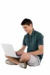 Teenage Boy working With Laptop Stock Photo