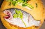 Place The Fish On A Cutting Board Stock Photo