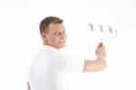 Young Guy Holding Rolling Brush Stock Photo