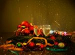 Two Glasses Of Champagne With A Christmas Decor In The Background Stock Photo