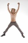 Shirtless Man Jumping High In Joy Stock Photo