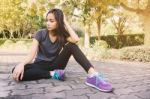 Woman Relaxing After Sports. Hipster Student In The City Park Stock Photo