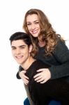 Girlfriend Enjoying Piggyback Ride Stock Photo