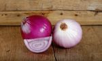 Red Onion On The Wooden Background Stock Photo