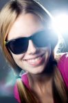 Happy Young  Woman With Sunglasses Looking At The Camera Stock Photo