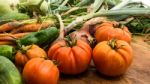 Several Vegetables On Wooden Chopping Board And Table Stock Photo