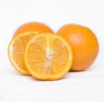 Orange Fruit Cut Into Two Pieces Stock Photo