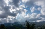 The Beauty Of The Sky When Light Hits The Clouds And Mountain Stock Photo