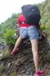 Women Climbing The Mountain Stock Photo