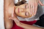 Woman Having Facial Mask At Beauty Salon Stock Photo